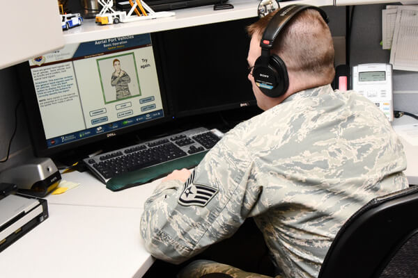 SSgt. Gregory Schmidt, USAF EC, 423rd Mobility Training Squadron/Mobility Training Logististics Transportation sits at a computer on January 29, 2015 to demonstrate taking one of the many online training courses offered through the US Air Force Expeditionary Center.