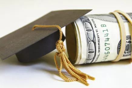 Graduation Cap and Roll of Cash, close-up