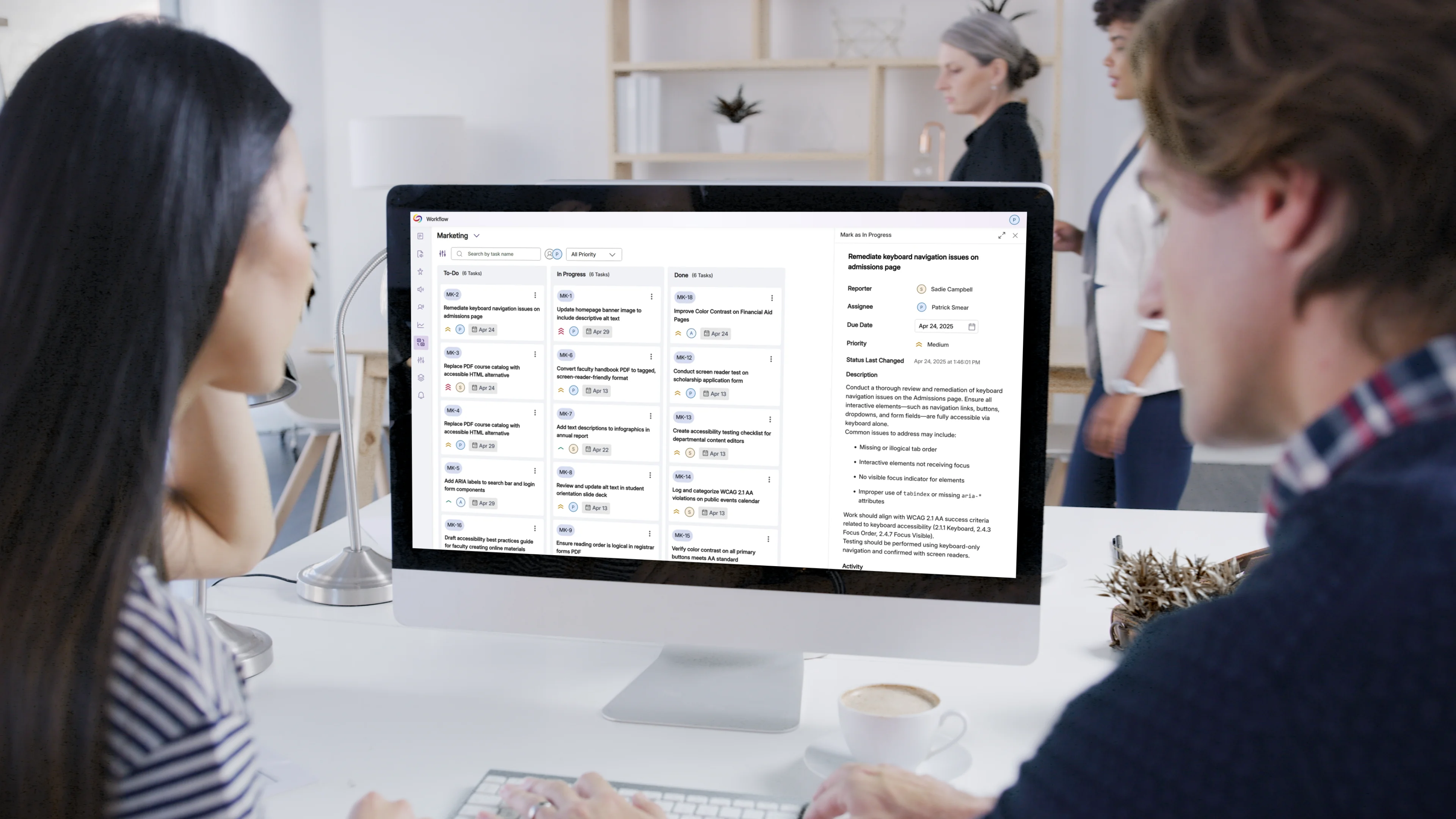 Two people looking at the tasks on the Panorama Workflow orchestration screen.