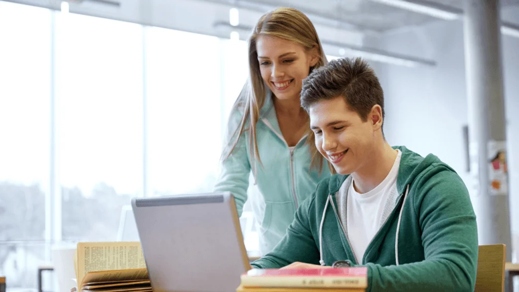A student looking at a laptop
