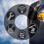 A man in a suit holding a digital cloud icon from an internet related graphic.