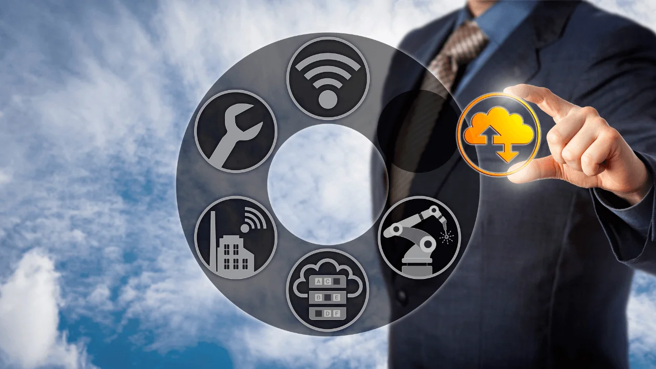 A man in a suit holding a digital cloud icon from an internet related graphic.