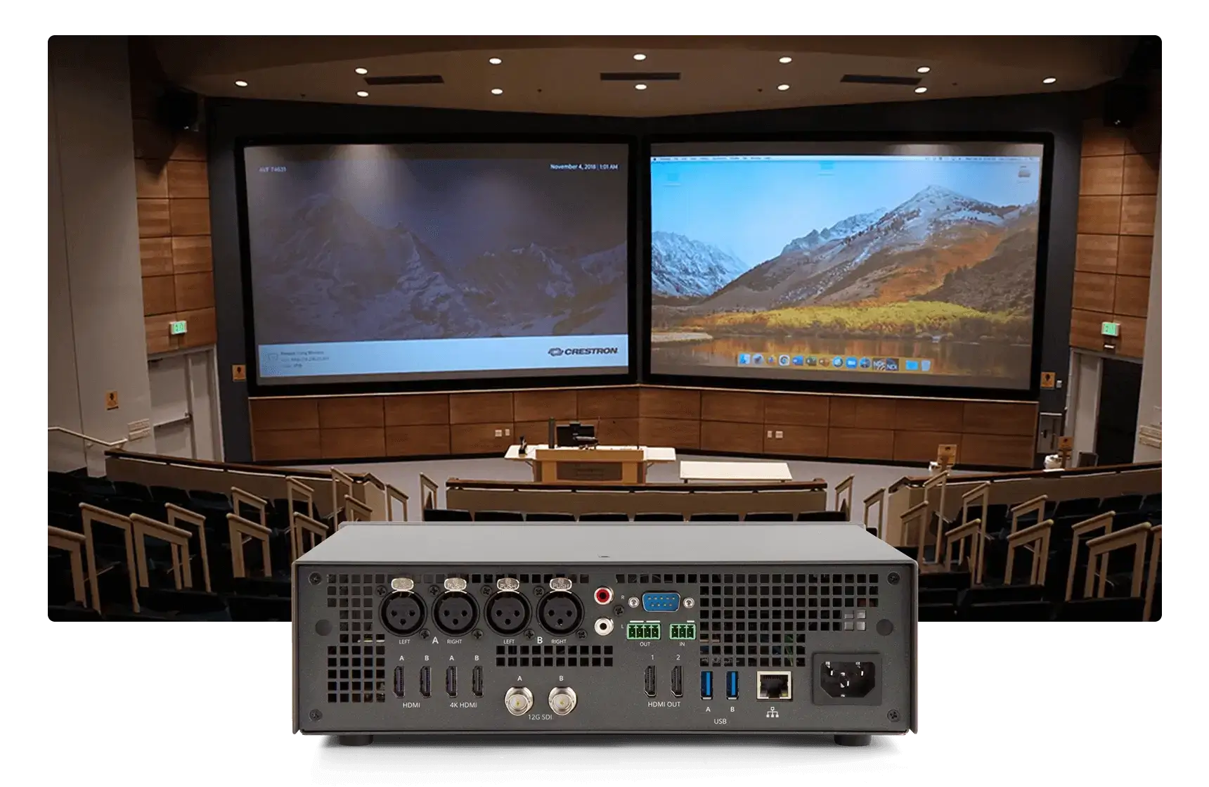A large screen displayed in front of a spacious auditorium.