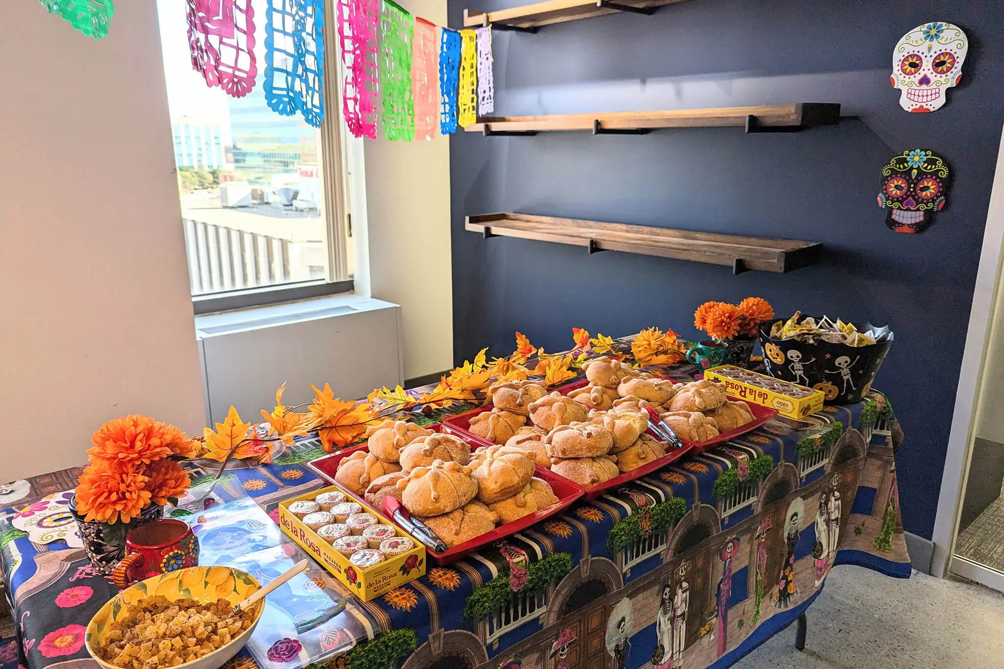 A vibrant table set for a Mexican-themed party, adorned with colorful decorations and an array of traditional dishes.