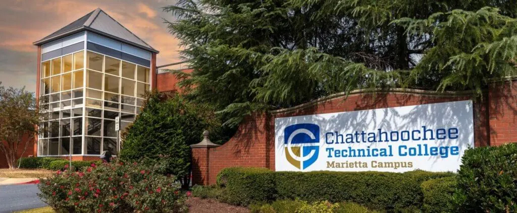 Chattahoochee Technical College's Marietta Campus sign with a building in the background.