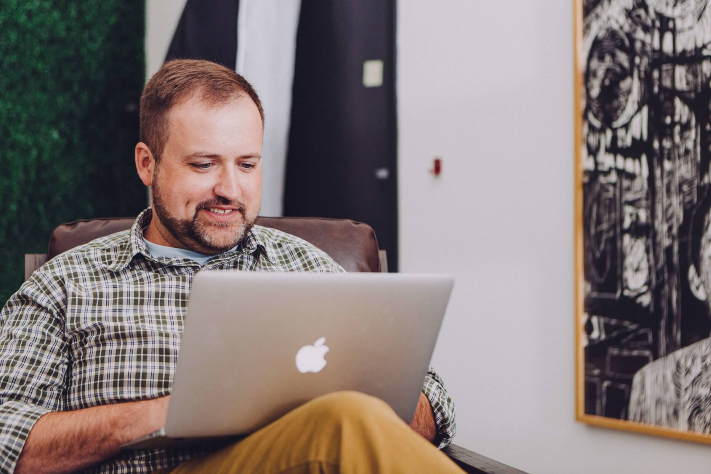 Stock Image of Man Using Laptop