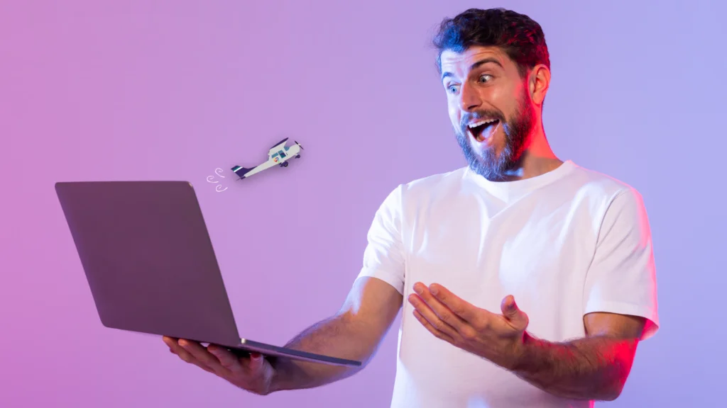 An excited young man holds a laptop and watches as Accessibility AutoPilot.AI zooms towards him.