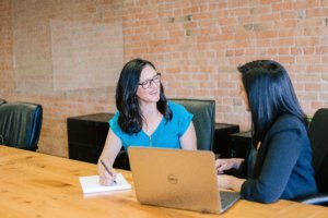 Two women collaborating