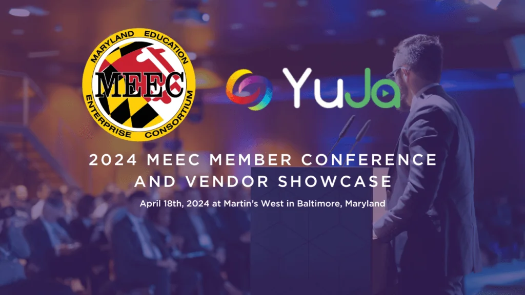 A keynote speaker on stage with the YuJa logo and MEEC logo