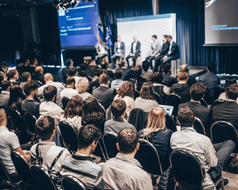 A panel of speakers at a conference