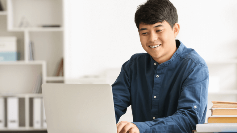 A student is studying on a laptop.