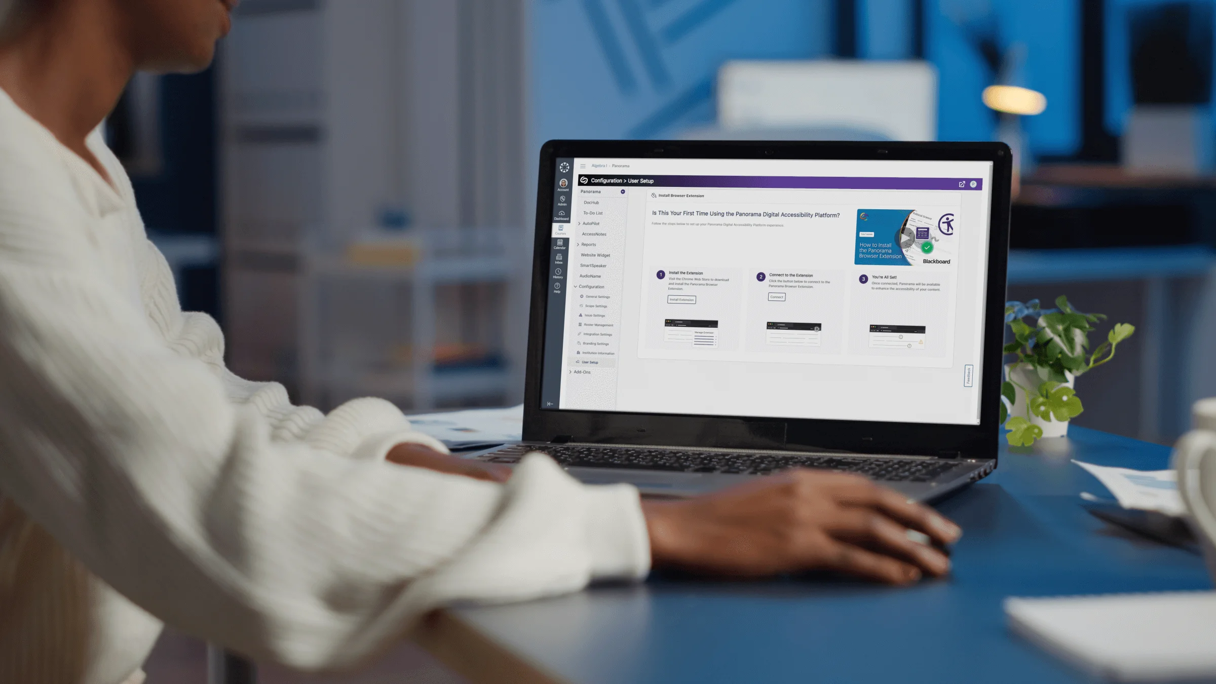 A woman using a laptop, which features the new User Setup page in Panorama.