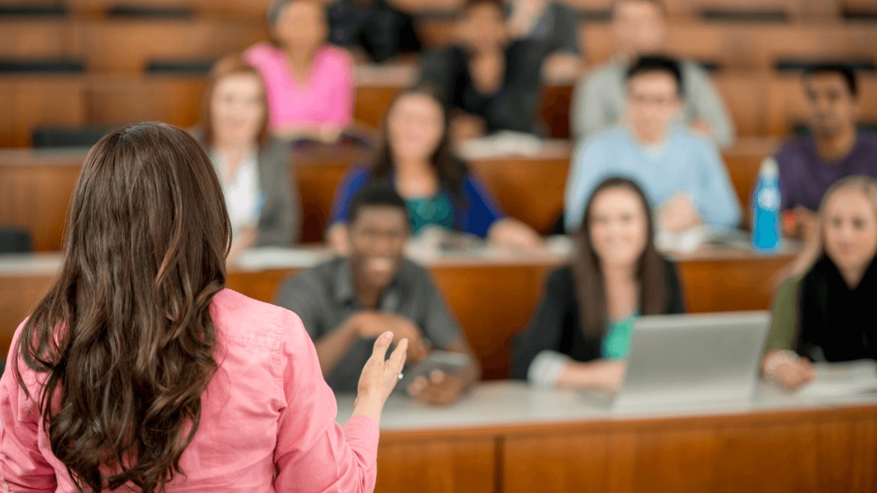 An instructor speaking to a classroom.