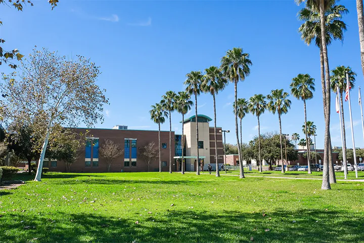Buildings surrounded by palm trees at South Texas College’s Mid-Valley Campus in Weslaco, Texas.
