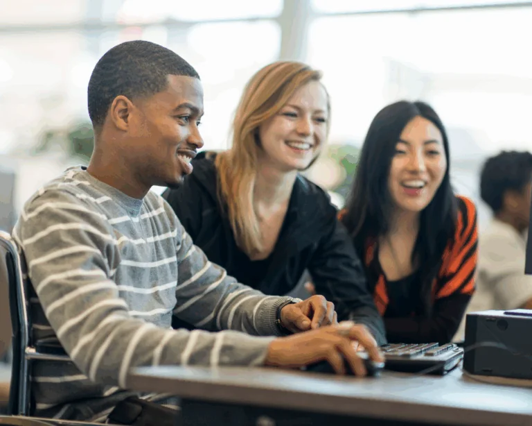 Students looking at a computer.