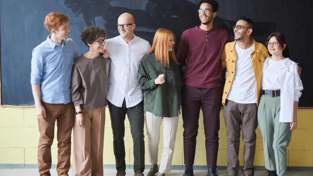 A group of students with their arms around each other.