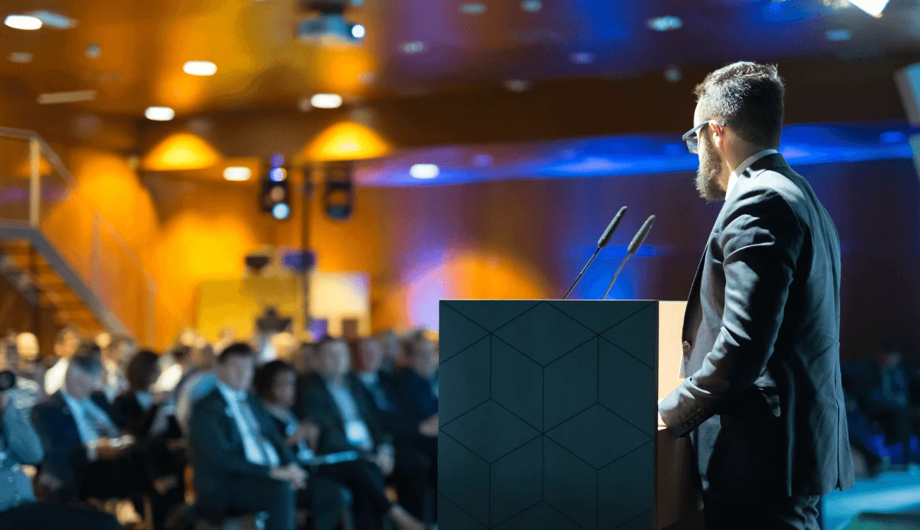 A speaker presents to an audience.