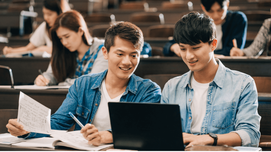 Two students looking at an analytics screen