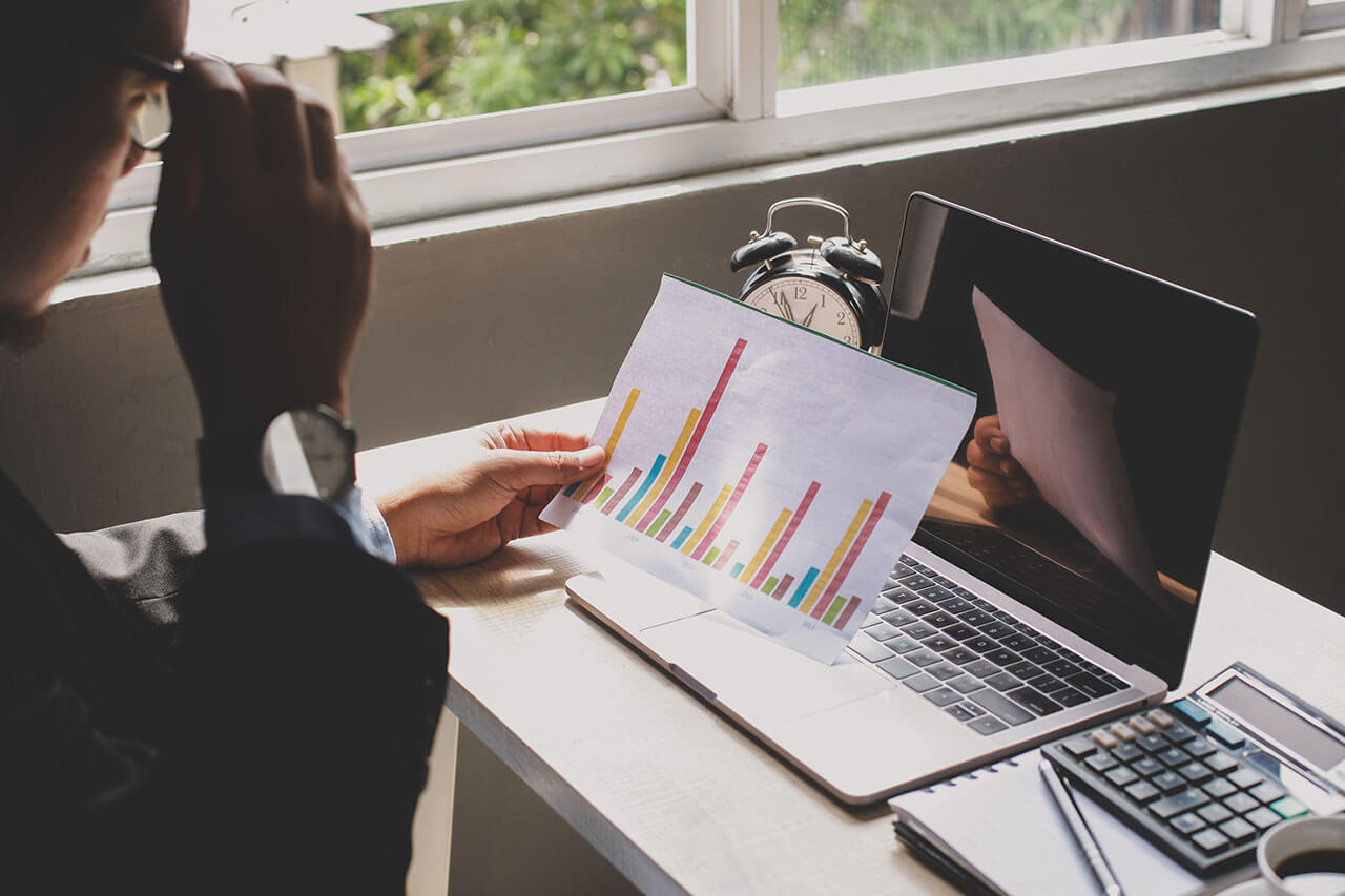 Instructor reviewing analytics from a chart.