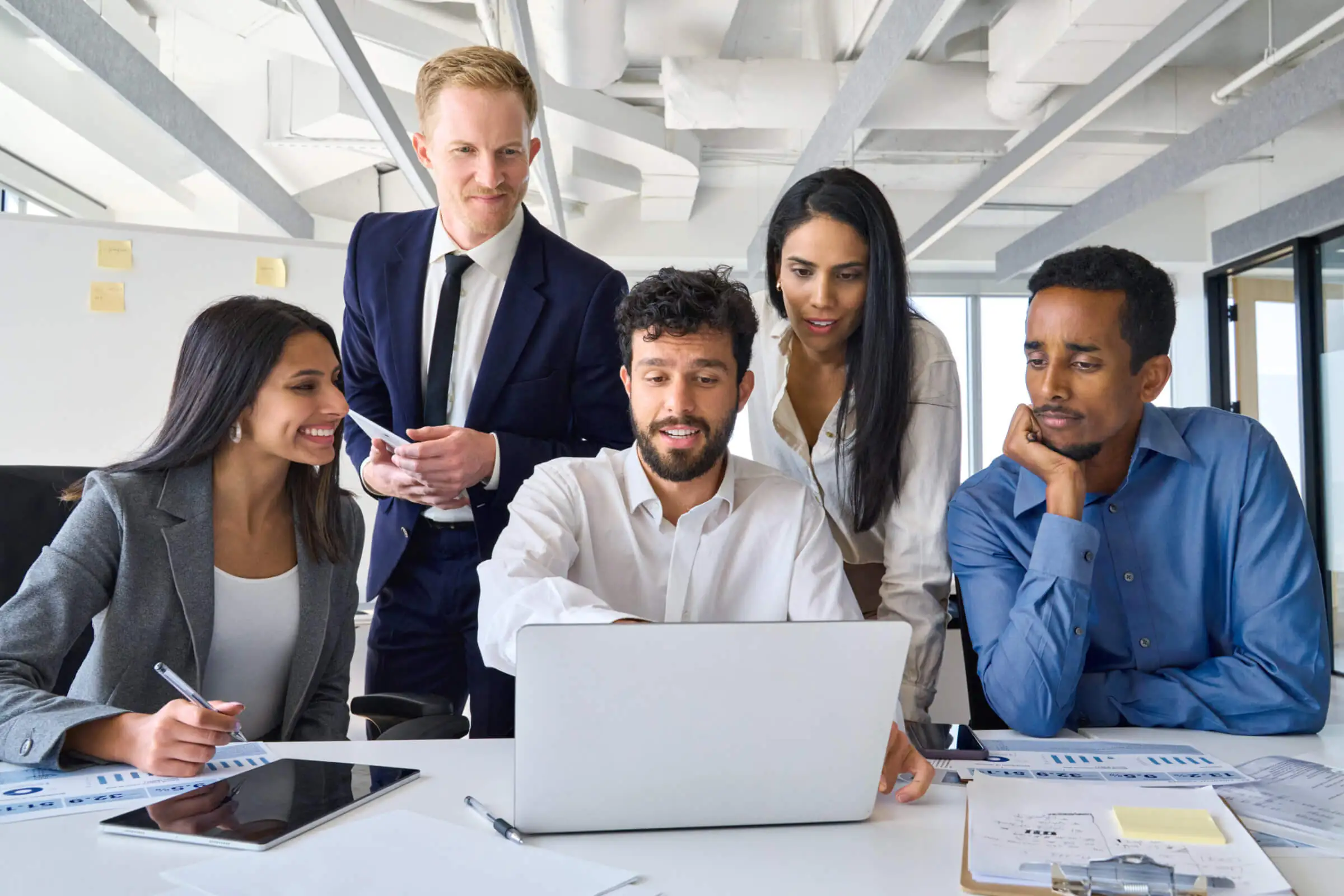 Busy, diverse, professional business people working together.