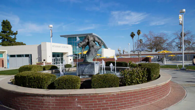 A fountain in front of the student center building at Taft College.
