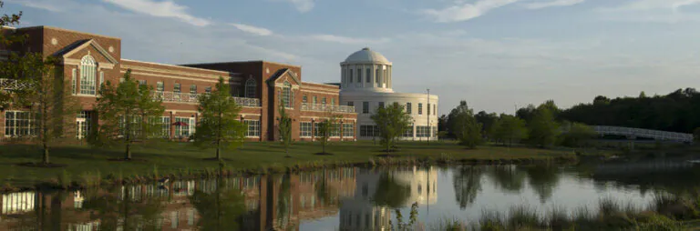 A view of University of Maryland Eastern Shore by a pond.