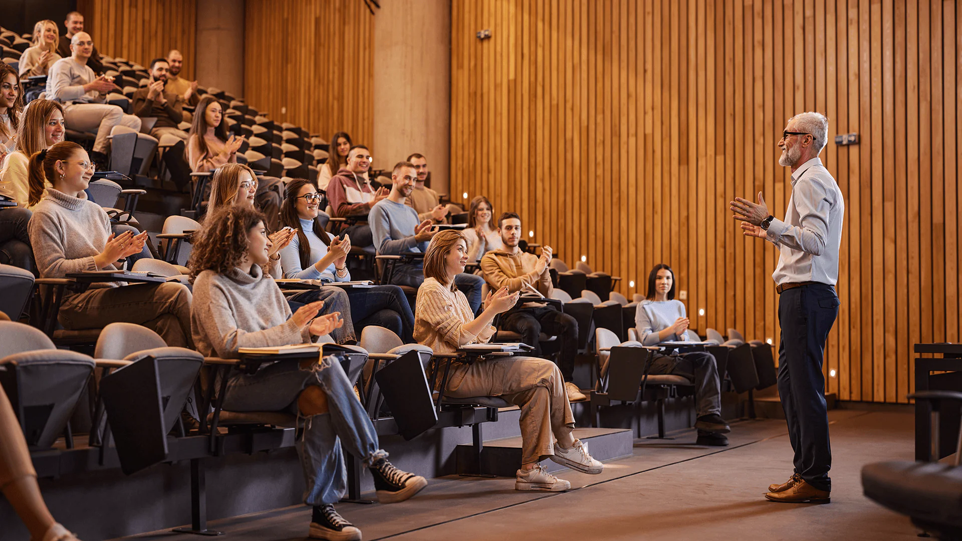 A professor is giving a lecture to his students.