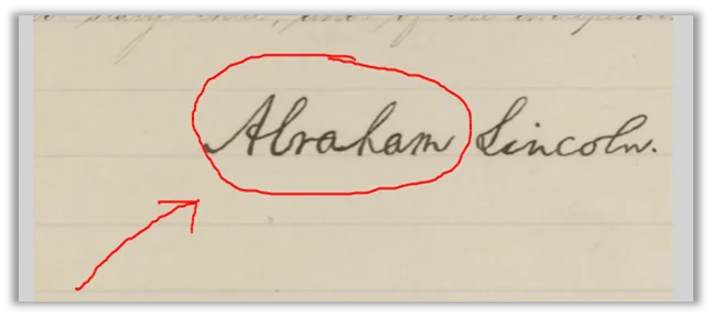 A handwritten document with the word Abraham Lincoln written on it.