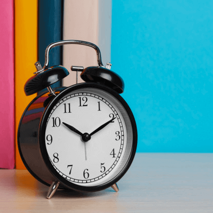 A alarm clock on a vibrant background.