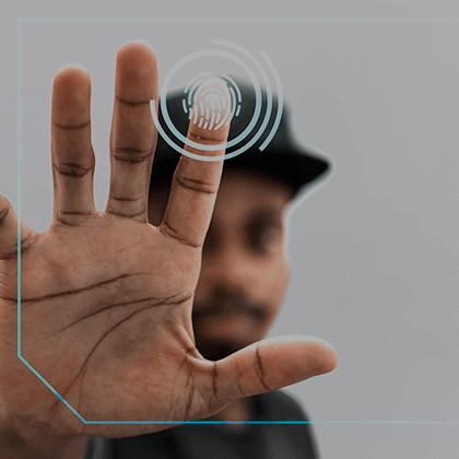 A man displaying his finger with a fingerprint.