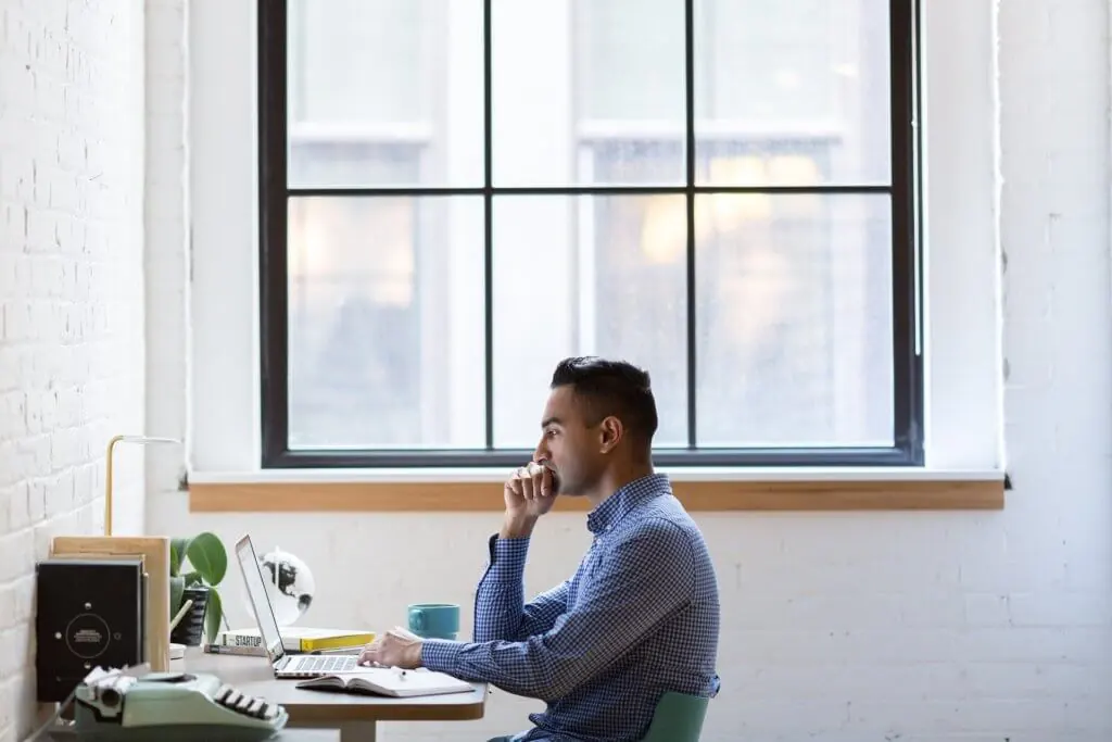 Man working on computer.