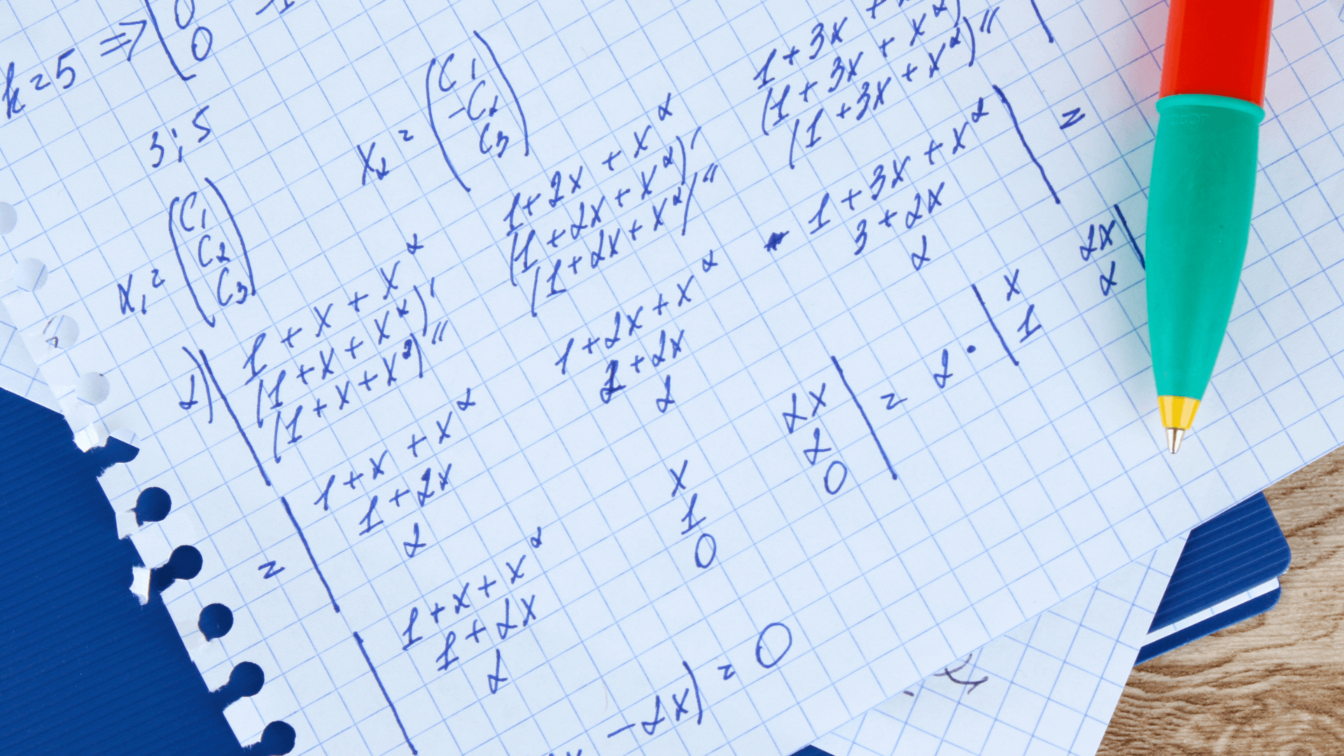 A notebook with math equations written on it.