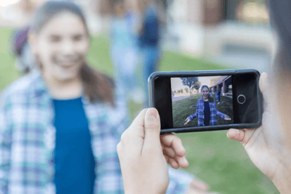 College student is recorded using cell phone. 