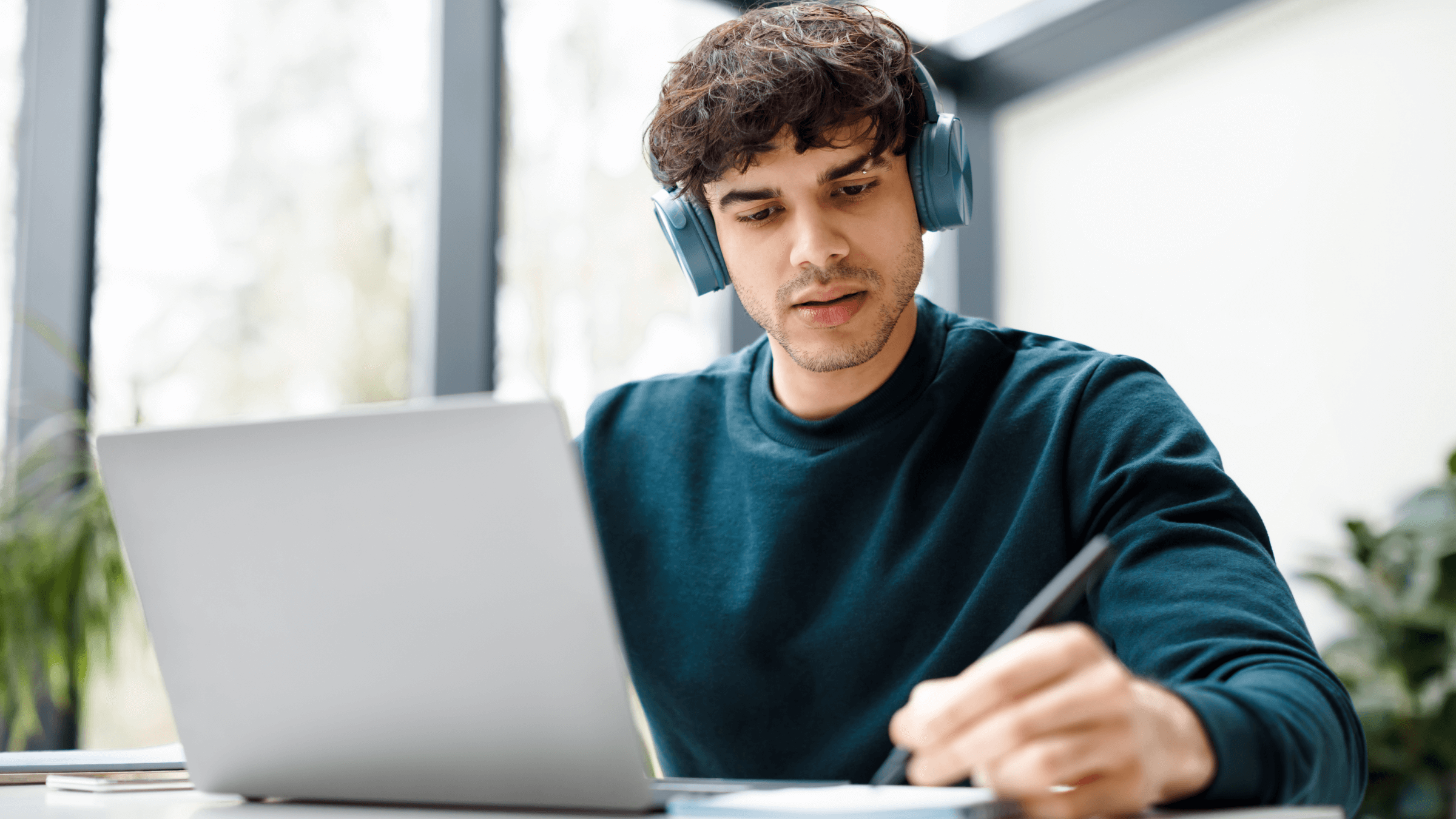 A young man taking an online test.