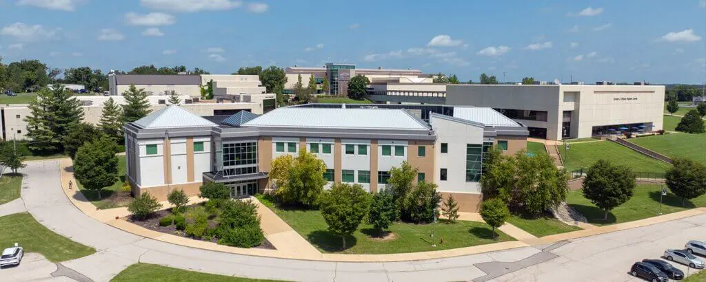 A view of the East Central Campus building under a clear blue sky.