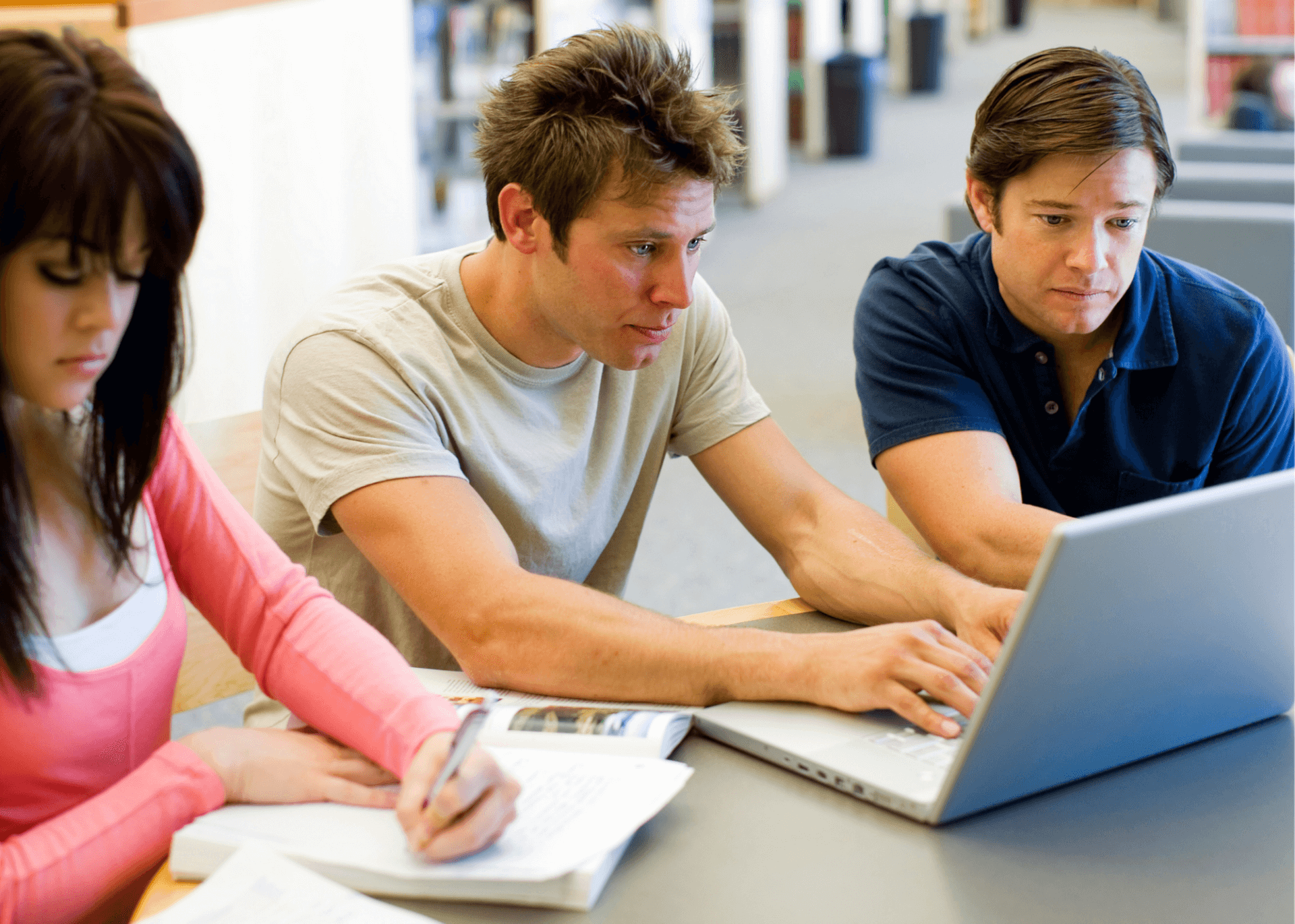 College-aged students study together.