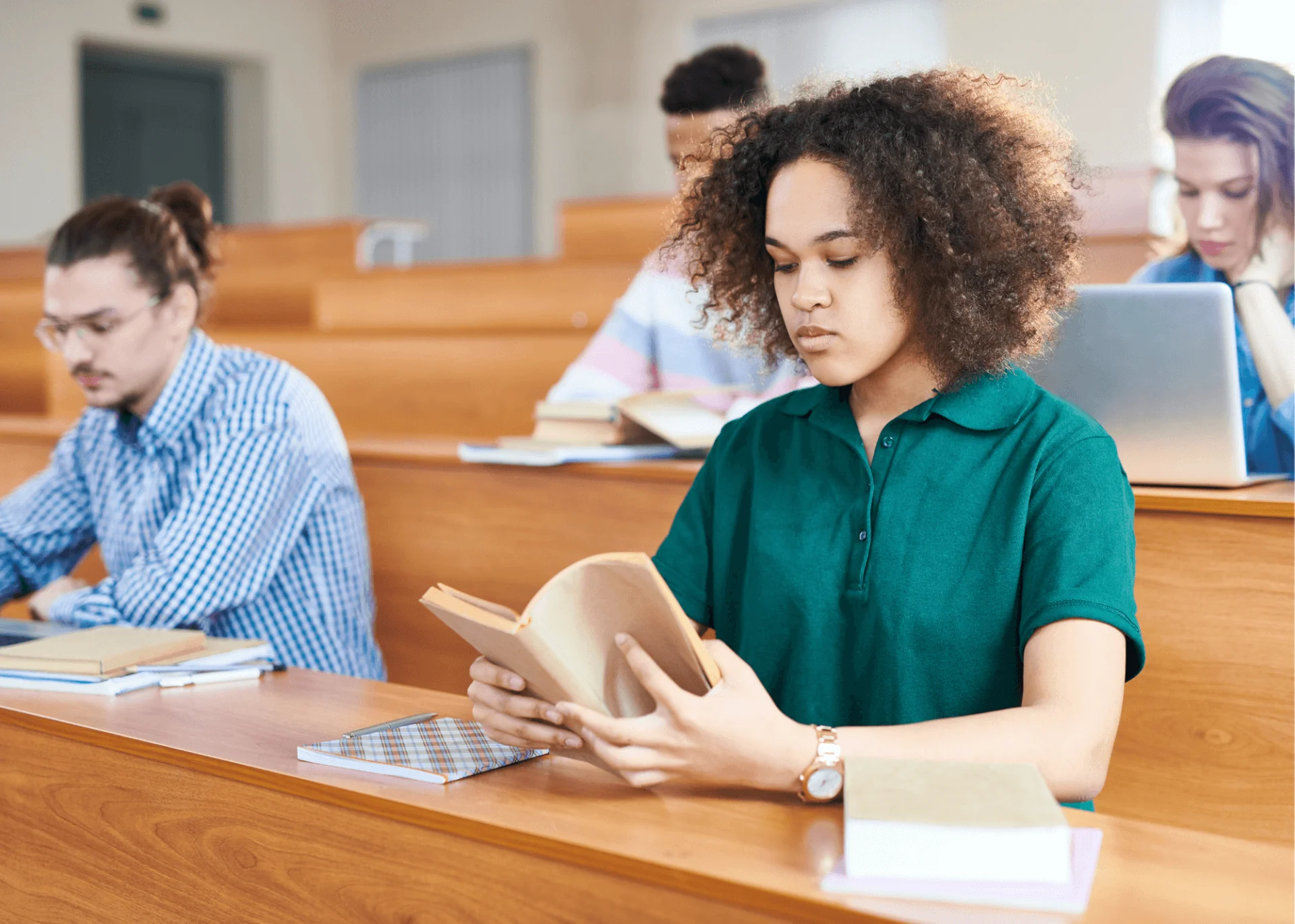 Woman studies in lecture hall