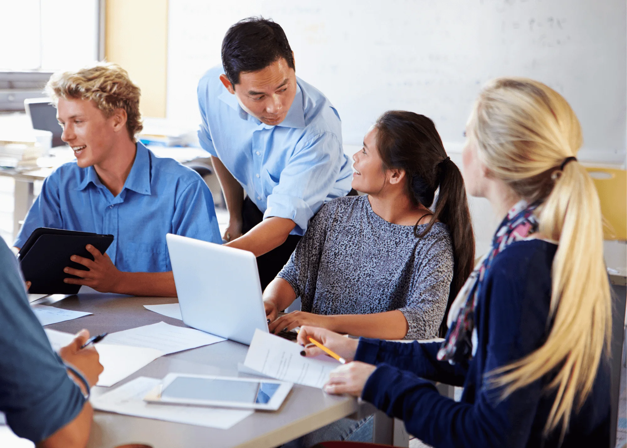 Teacher interacts with a group of college students