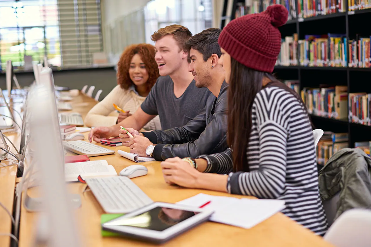 Students working on a group project in a library