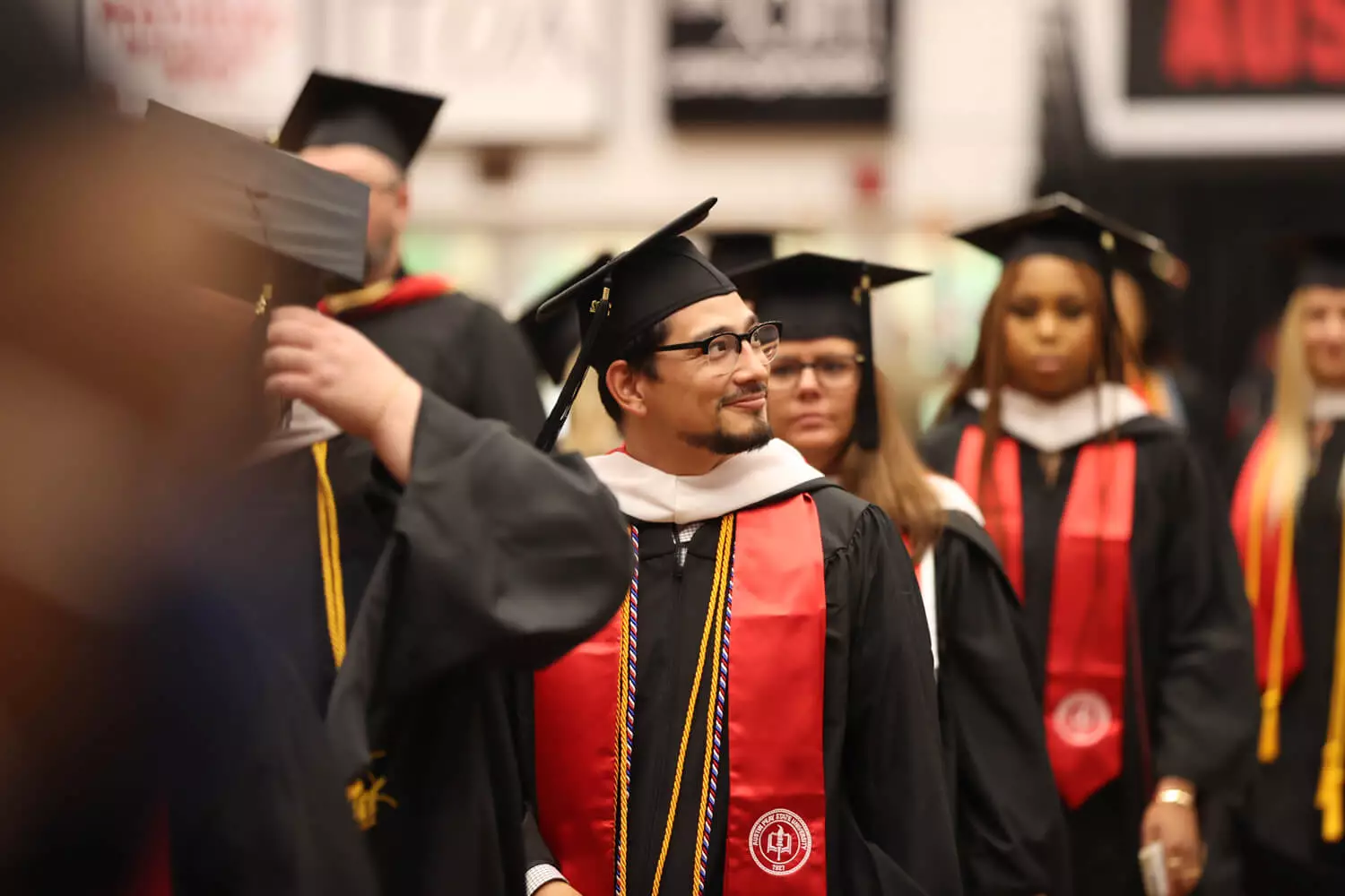 Austin Peay State University graduates walking down the aisle.