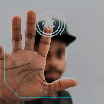 A man displaying his finger with a fingerprint.